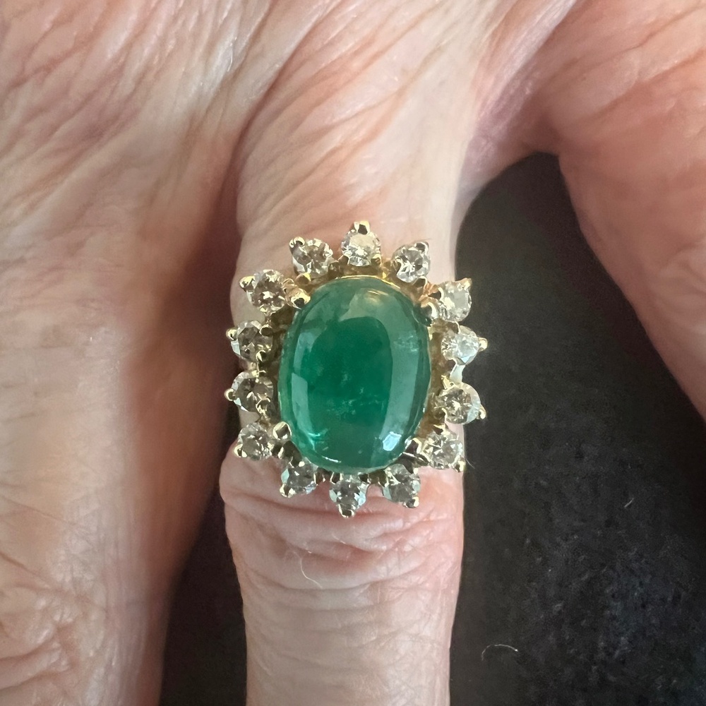 Beautiful custom-made vintage 14K gold emerald ring surrounded with diamonds